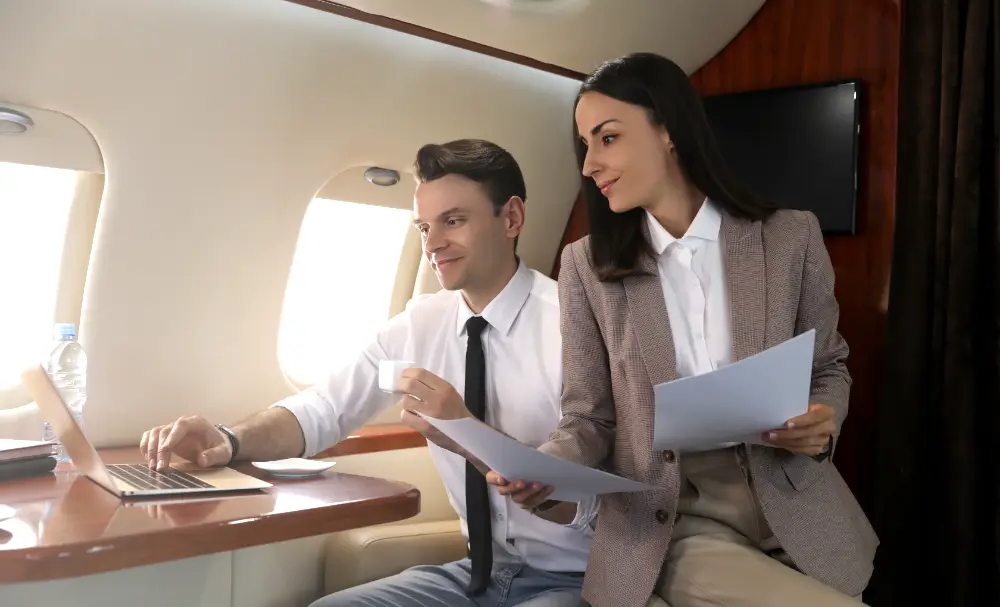 Relaxed colleagues working on an airplane