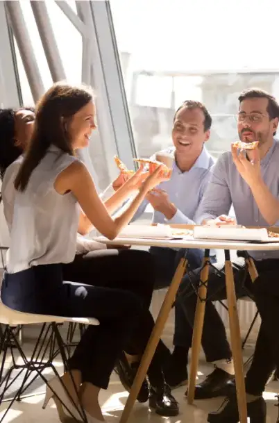 Work colleagues relaxing having lunch together
