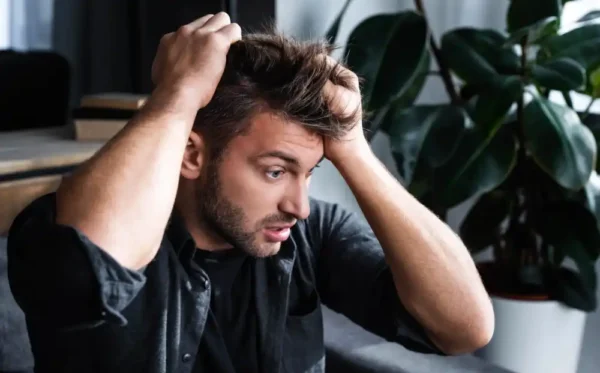 young man having panic anxiety attack